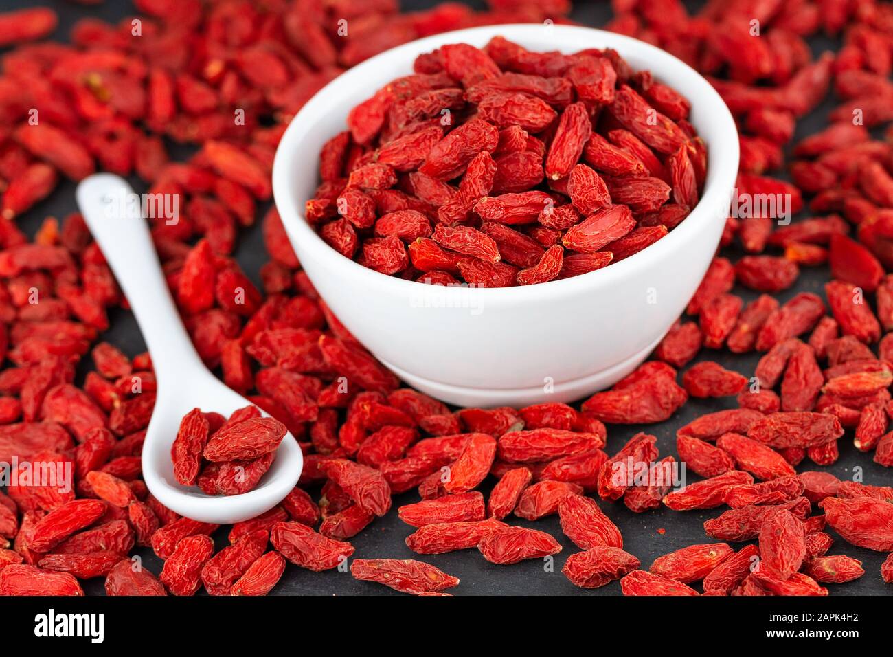 Red Organic Goji Berries In White Cup. Selective Focus Stock Photo