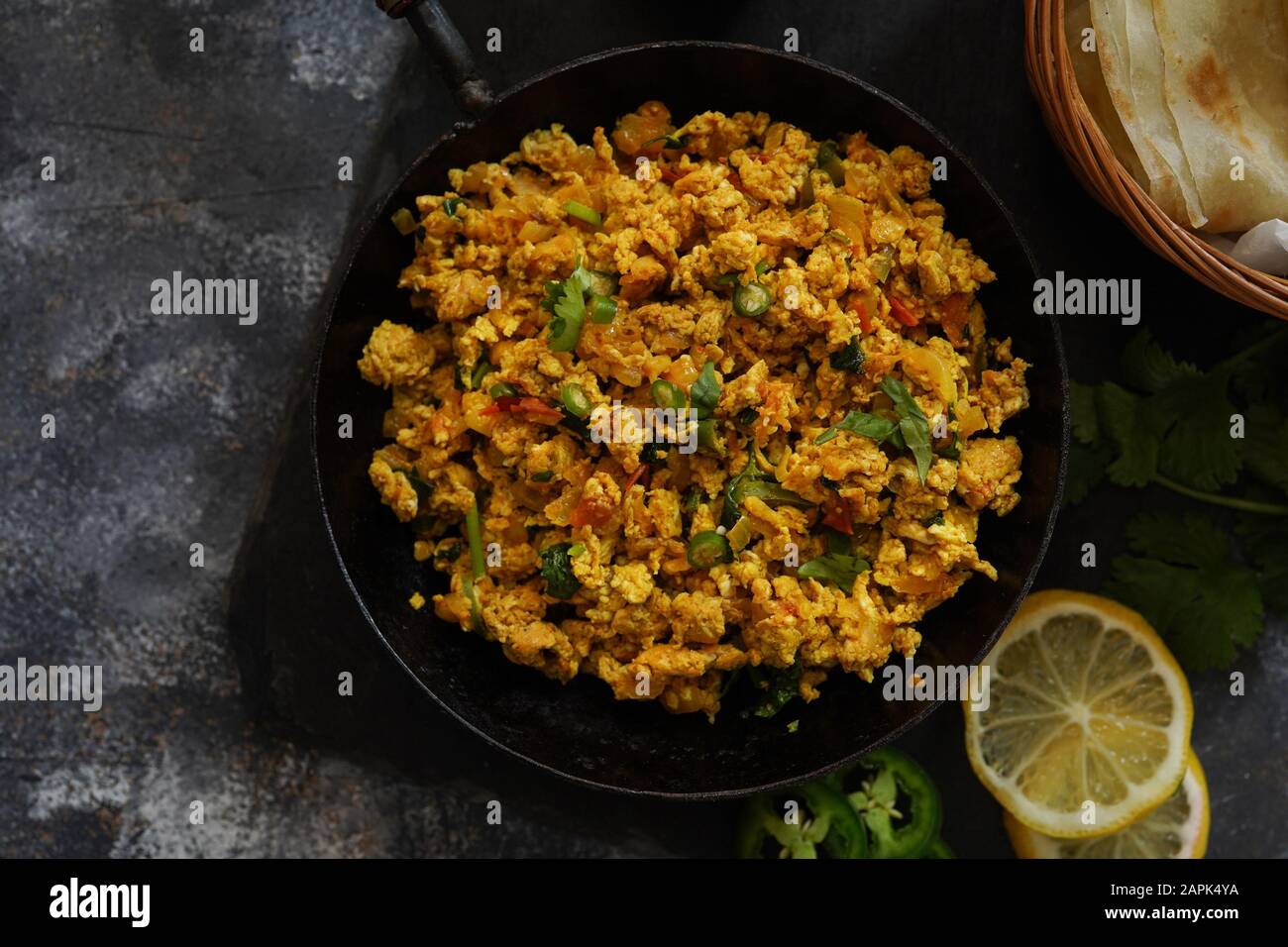 Scrambled eggs/ Masala egg Bhurji served with roti, selective focus Stock Photo