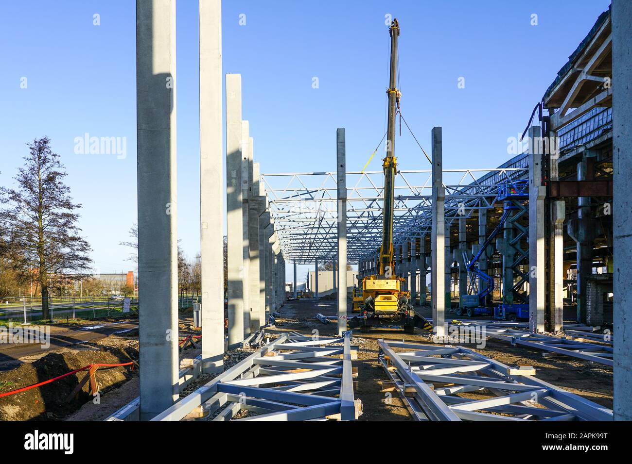 construction of the body of a modern factory, assembly of metal trusses Stock Photo