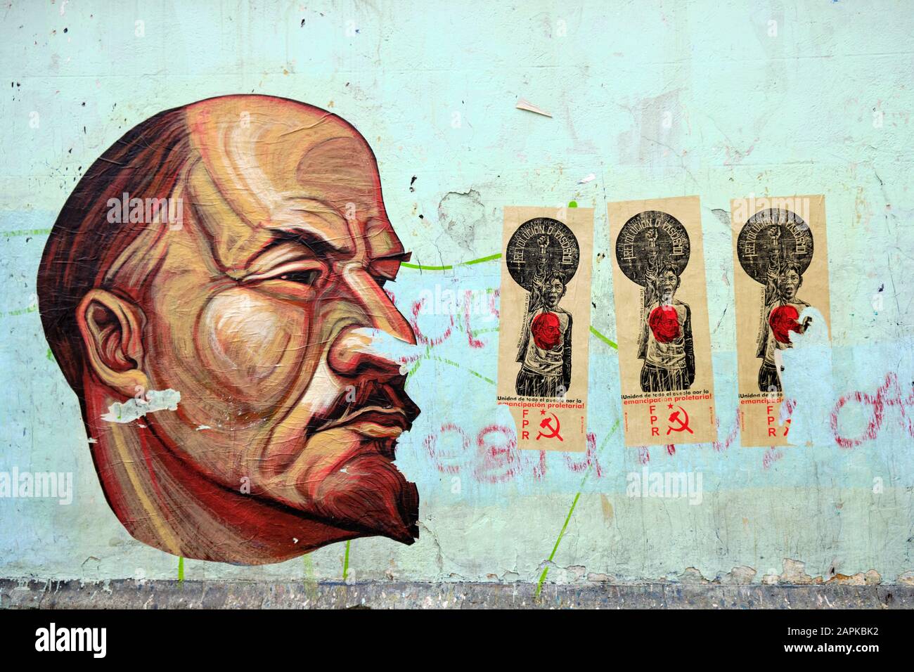 Three side by side poster of the FPR (Frente Popular Revolucionario)  next to a large head of Lenin, in Oaxaca Mexico Stock Photo