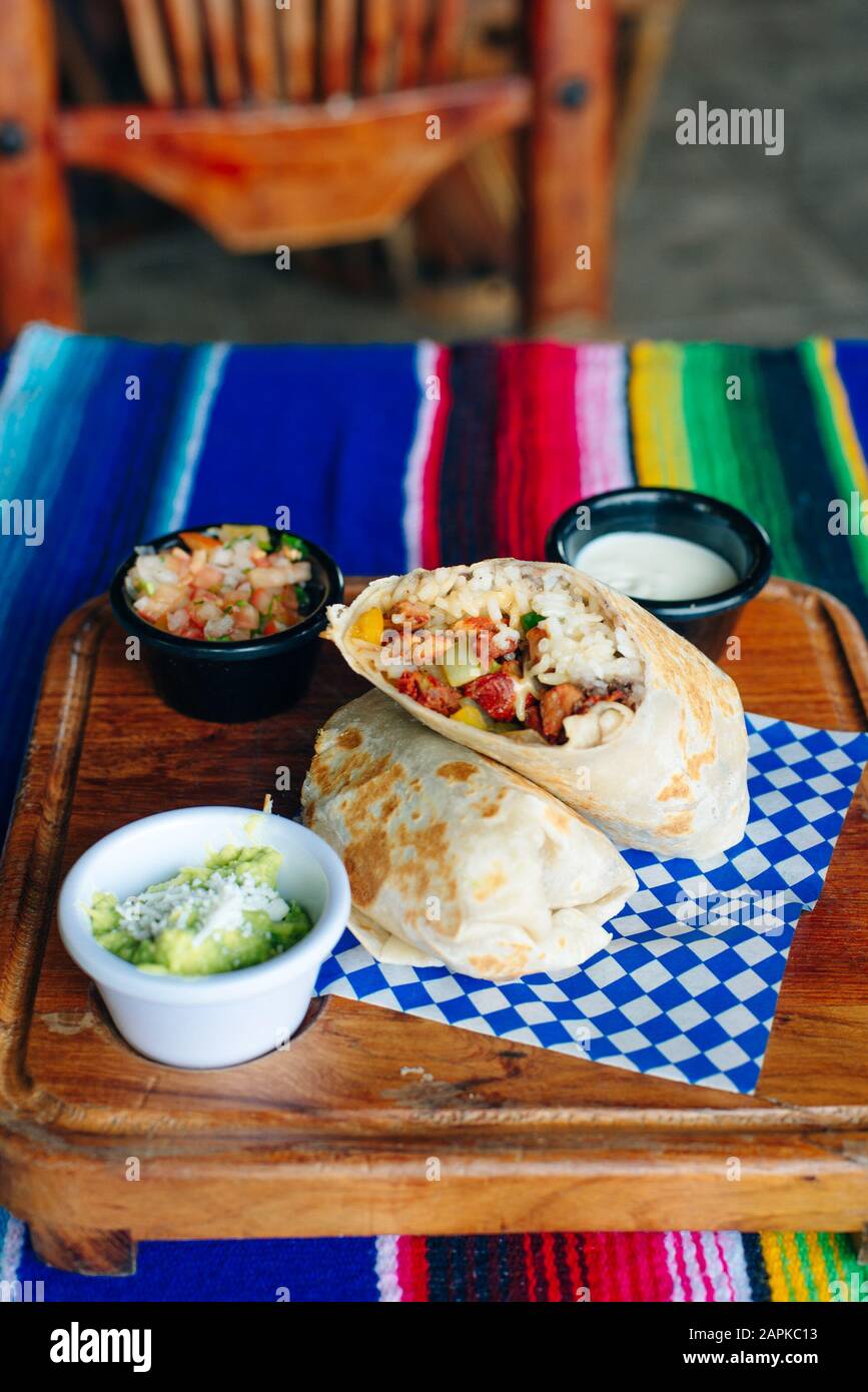 Vegetarian breakfast burrito with eggs and rice, sauces Stock Photo Alamy