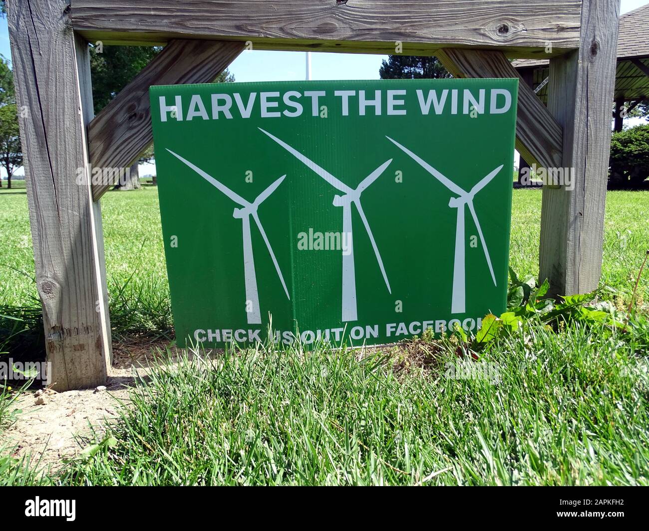 A sign showing three windmills adverting harvesting of the wind Stock Photo