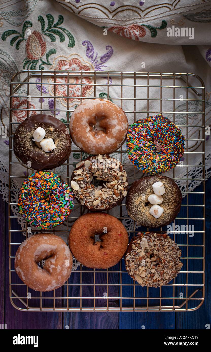 Beautiful doughnuts covered in chocolate glaze, sprinkles, marshmallows