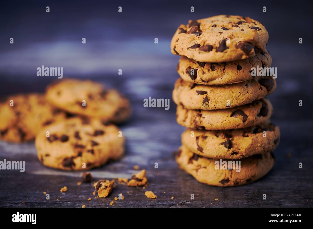 pile of chocolate cookies against wooden background with copy space Stock Photo