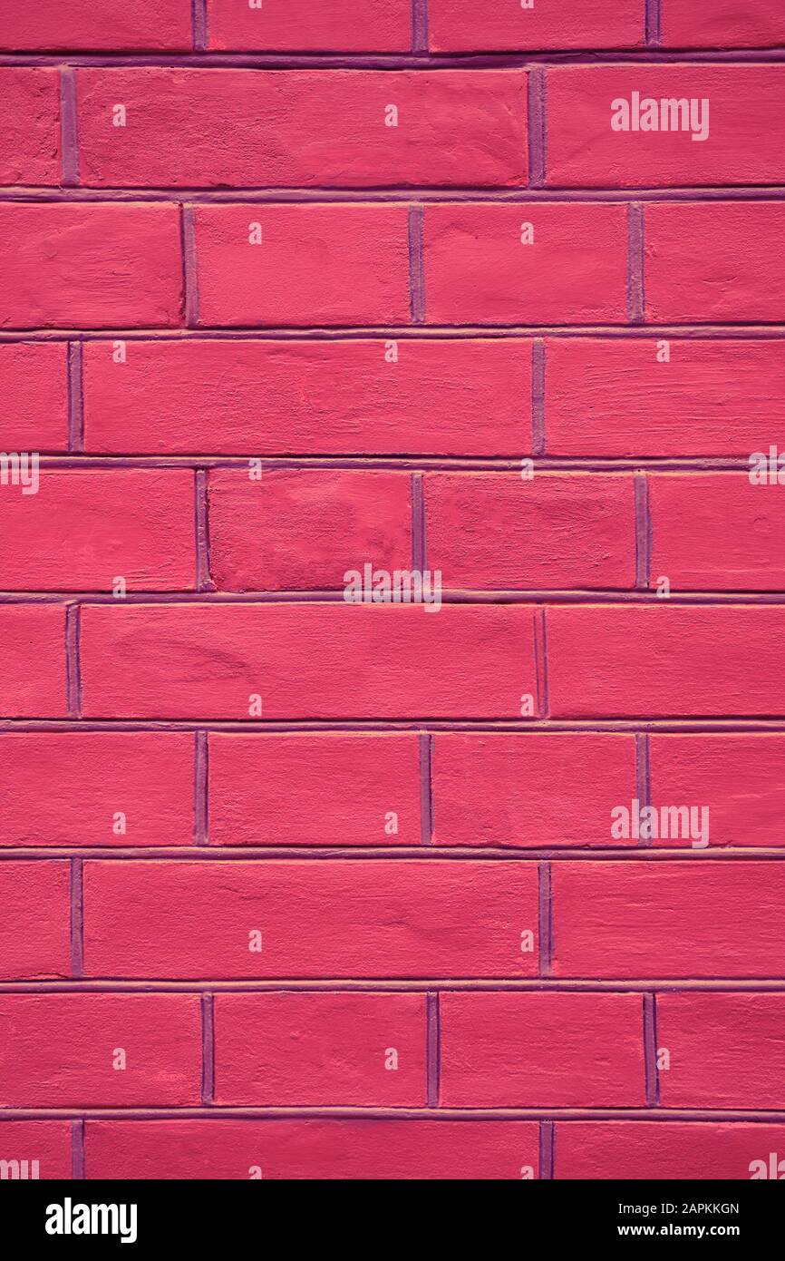 pink brick wall texture background close up vertical Stock Photo - Alamy