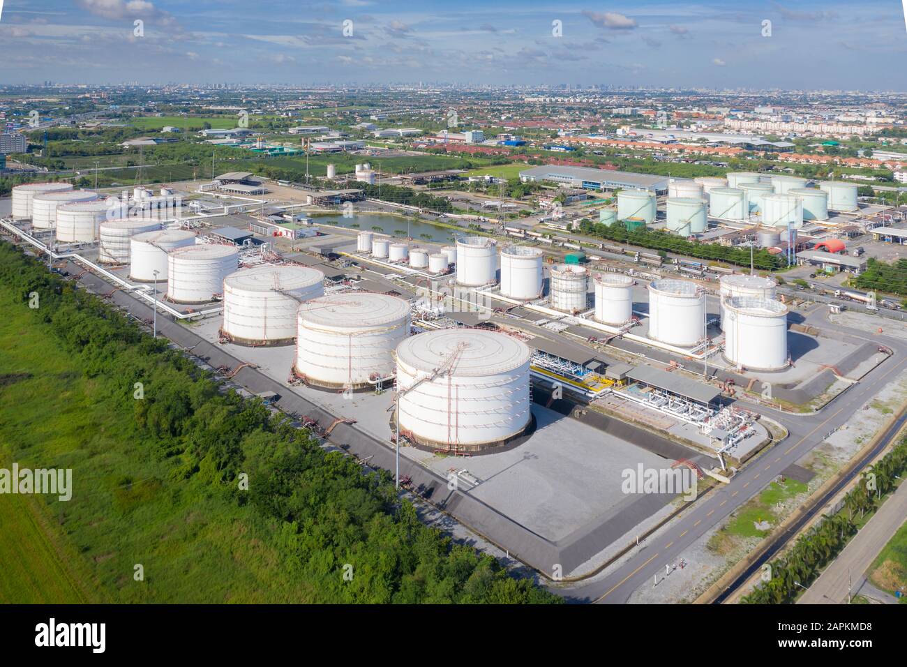 Aerial view of Chemical industry storage tank and tanker truck In wailting in Industrial Plant to tranfer oil to gas station. Stock Photo