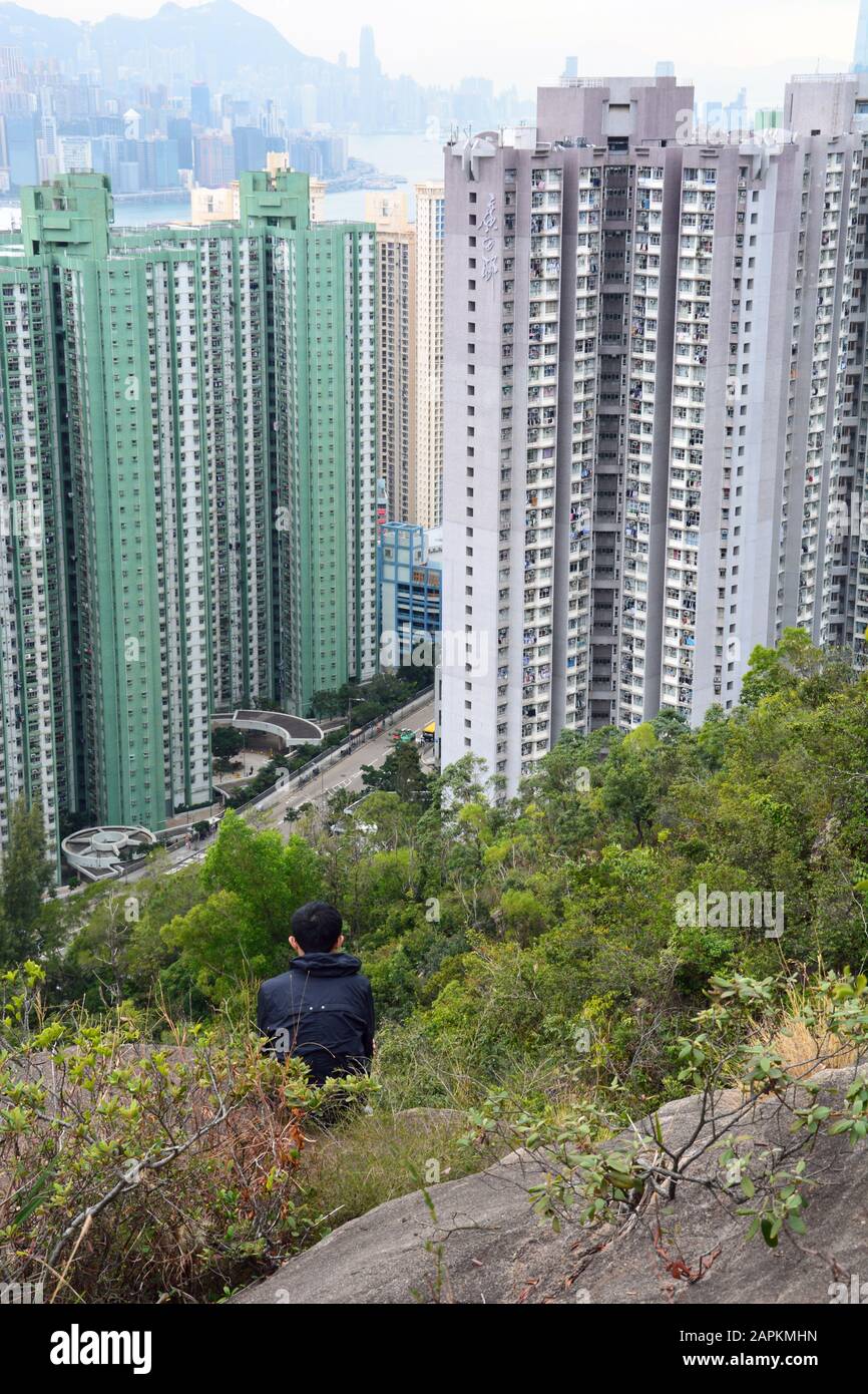 Overlooking apartments below the mountains outside of Hong Kong from Wilson's Trail. Stock Photo