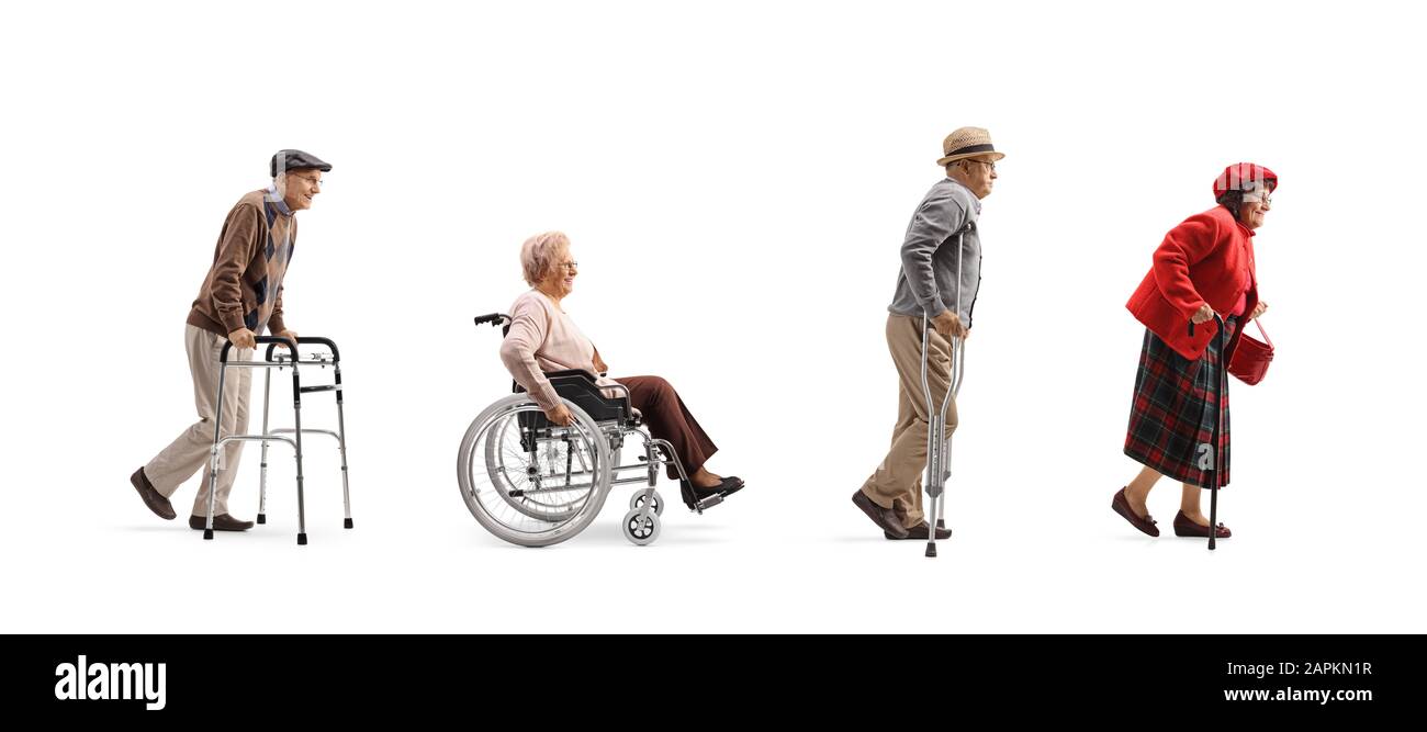 Full length profile shot of a group of senior people walking in a line with orthopedic equipment isolated on white background Stock Photo