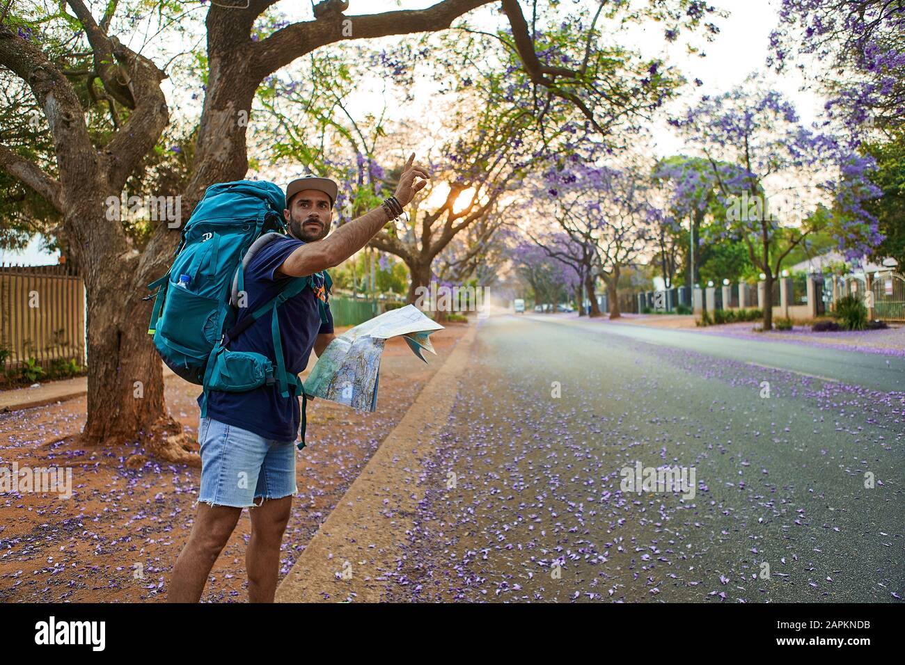 Hitchhiker with map on a street, Pretoria, South Africa Stock Photo