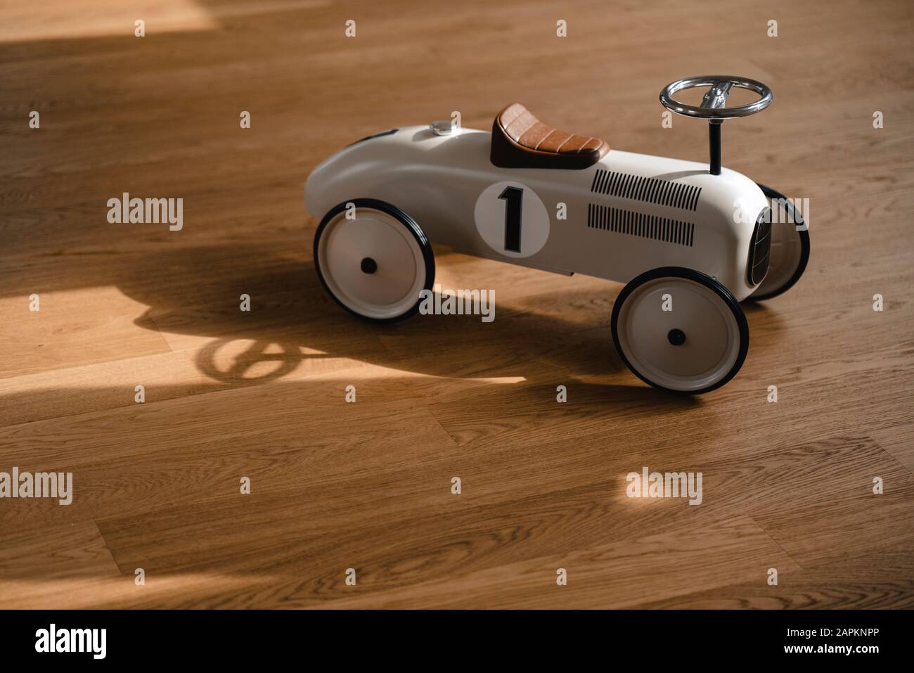 Toy car on wooden floor Stock Photo