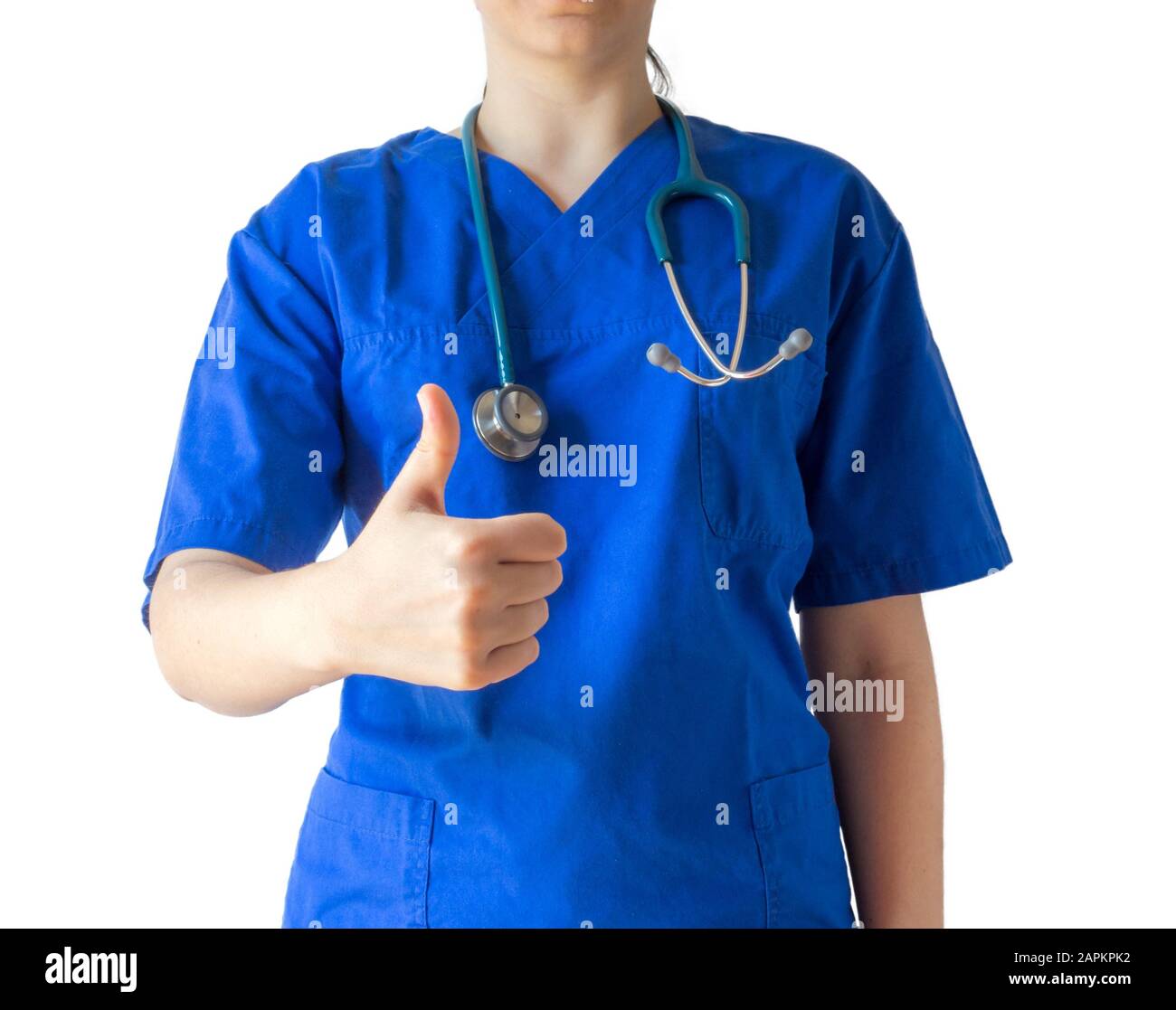 Young female doctor in a blue medical uniform showing a thumbs-up gesture Stock Photo