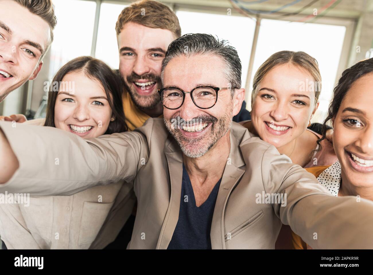 Group portrait of happy business people in office Stock Photo - Alamy