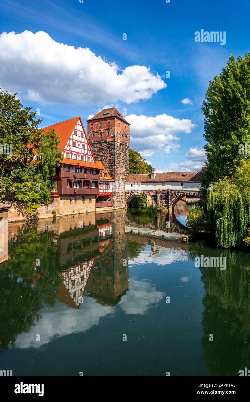 Germany, Nuremberg, Weinstadel and water tower by river Stock Photo