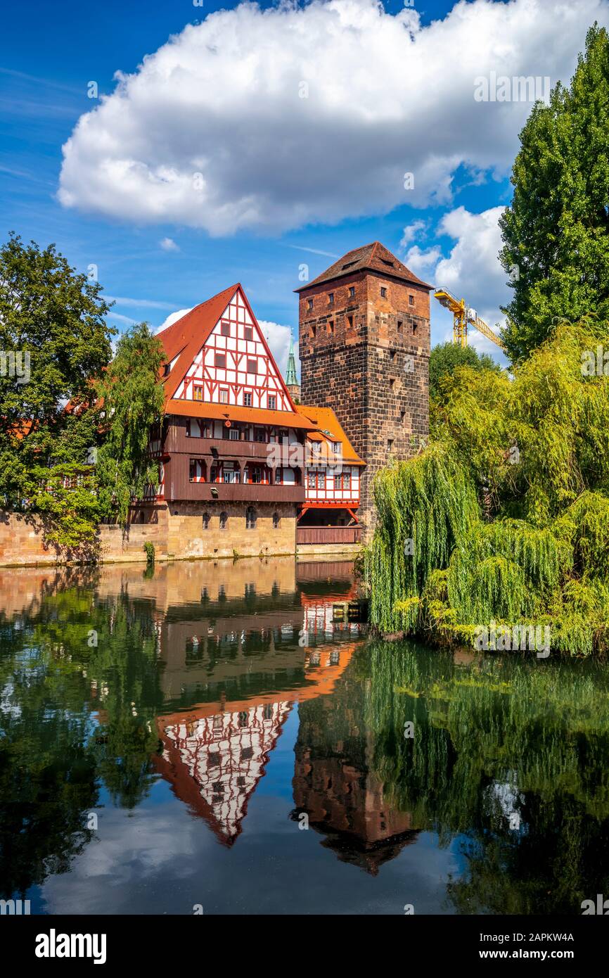 Germany, Nuremberg, Weinstadel and water tower by river Stock Photo