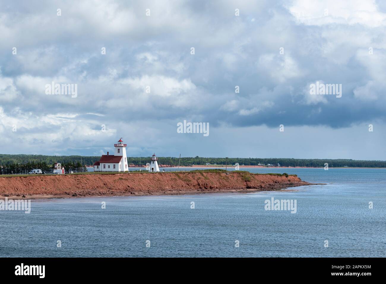 Canada, Prince Edward Island, Wood Islands, Large clouds over coastal lighthouses Stock Photo