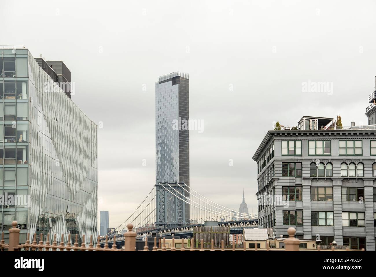USA, New York, New York City, Manhattan Bridge against One Manhattan ...