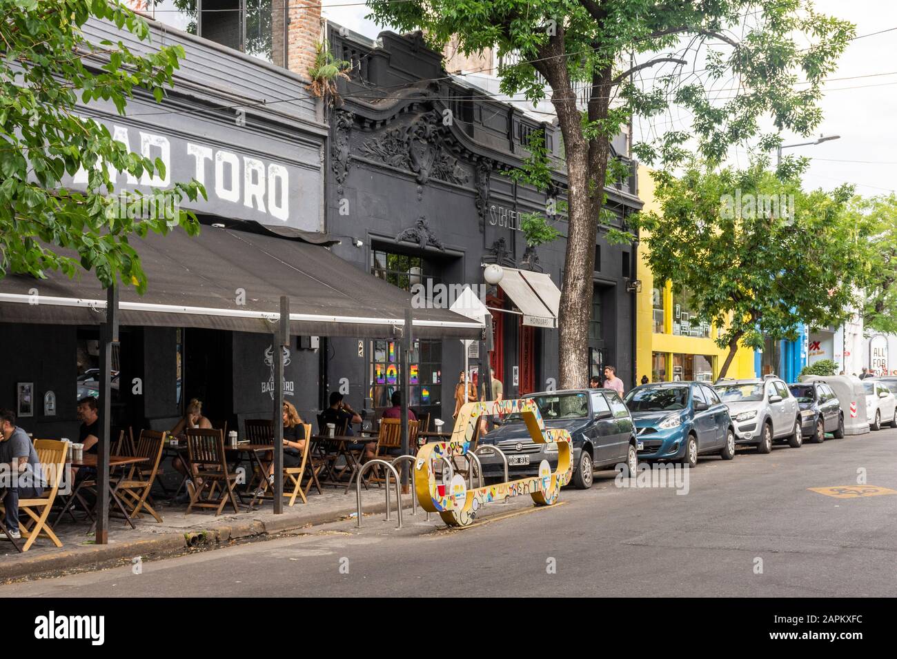 View to street and local buildings and shops in Palermo area, Buenos