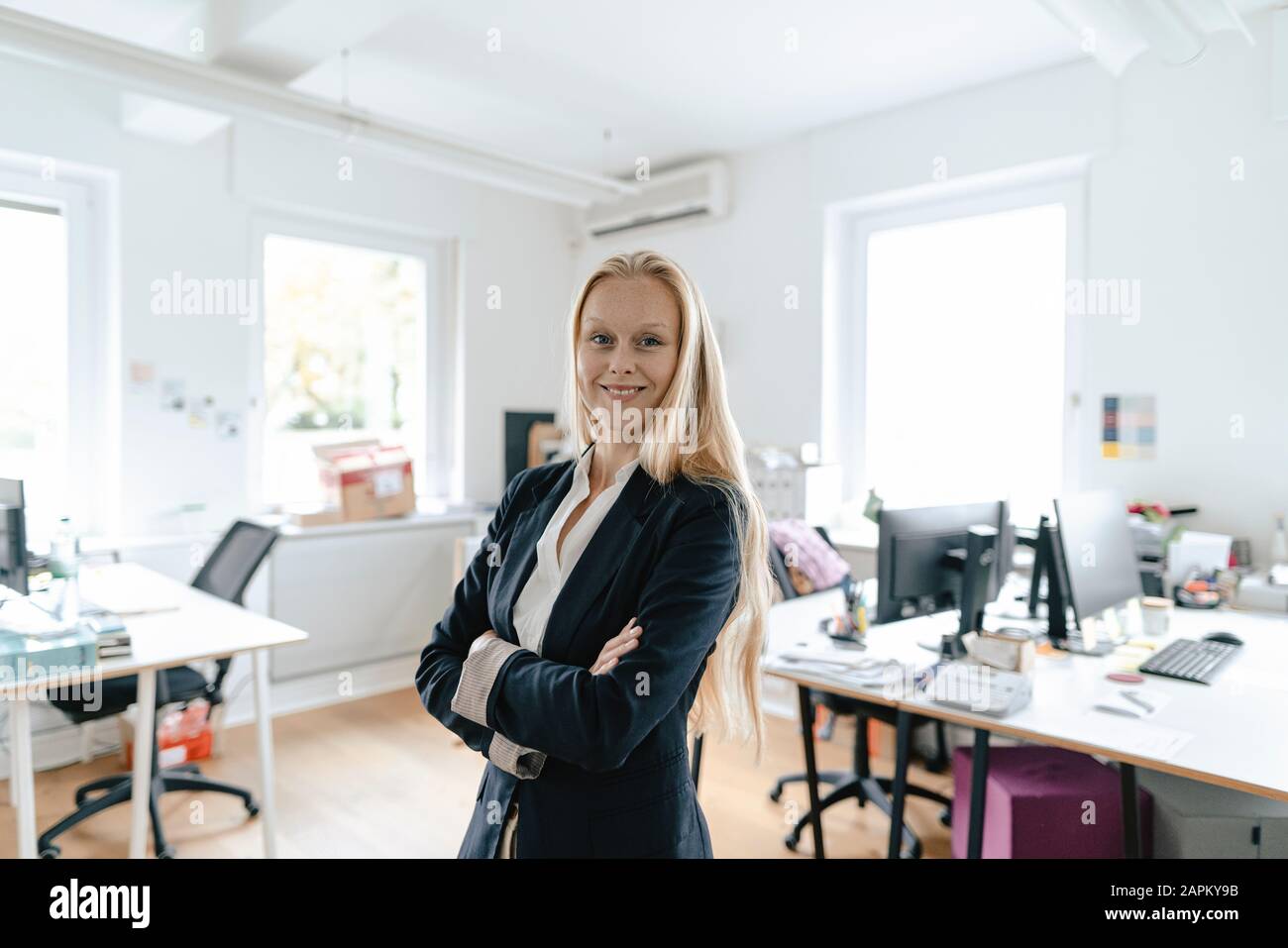 Portrait of a smiling young businesswoman in office Stock Photo