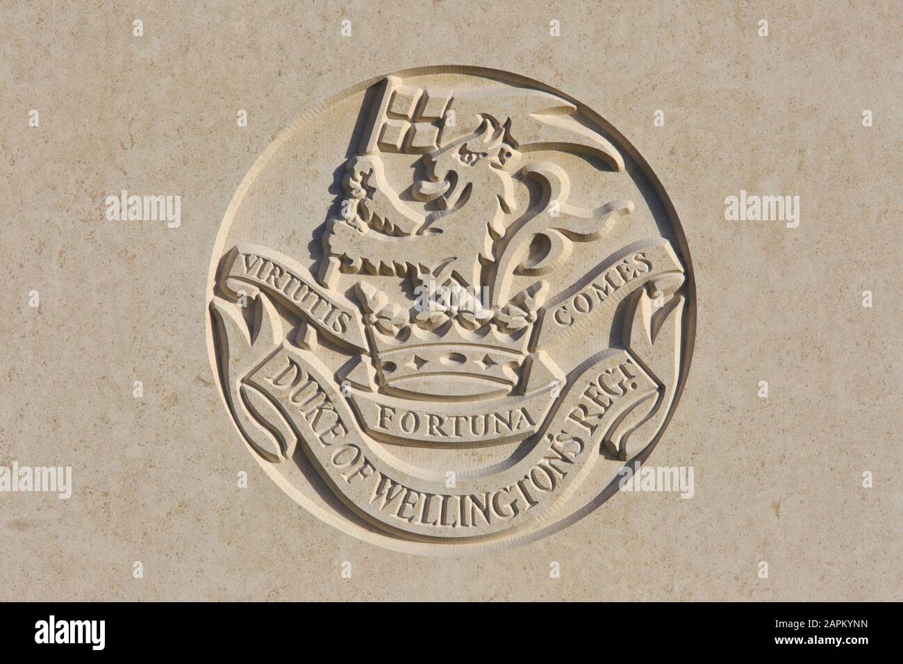 The Duke of Wellington's Regiment (West Riding) (1702-2006) regimental emblem on a World War I headstone at Tyne Cot Cemetery in Zonnebeke, Belgium Stock Photo