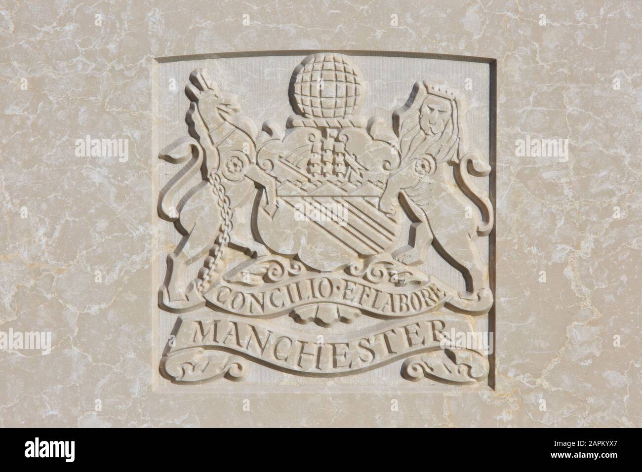 The Manchester Regiment (1881-1958) regimental emblem on a World War I headstone at Tyne Cot Cemetery in Zonnebeke, Belgium Stock Photo