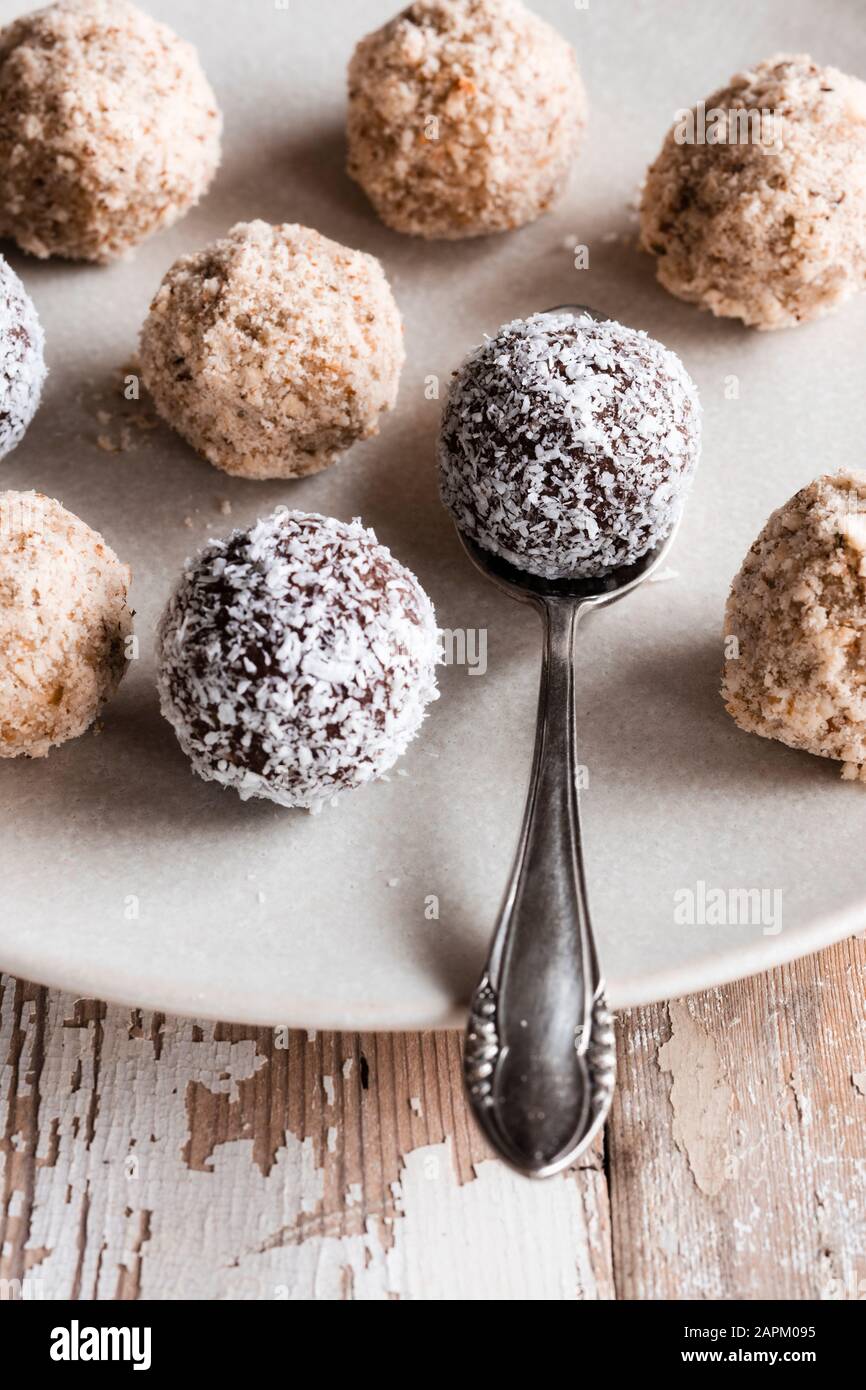Vegan protein balls with millet, coconut, cocoa and nuts Stock Photo