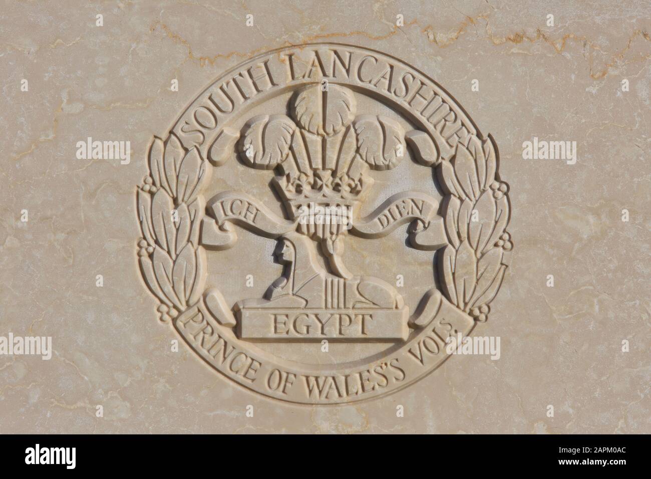 The Prince of Wales's Volunteers South Lancashire Regiment regimental emblem on a World War I headstone at Tyne Cot Cemetery in Zonnebeke, Belgium Stock Photo