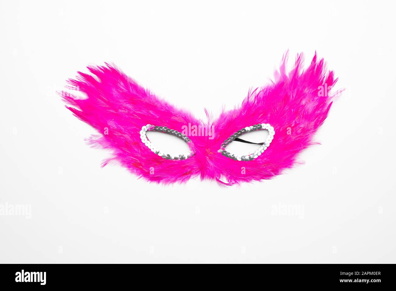 Fancy pink feather mask with silver beads isolated in white background