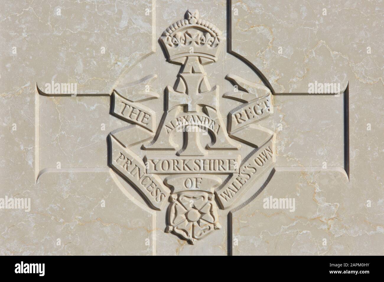 The Alexandra, Princess of Wales's Own Yorkshire Regiment regimental emblem on a World War I headstone at Tyne Cot Cemetery in Zonnebeke, Belgium Stock Photo