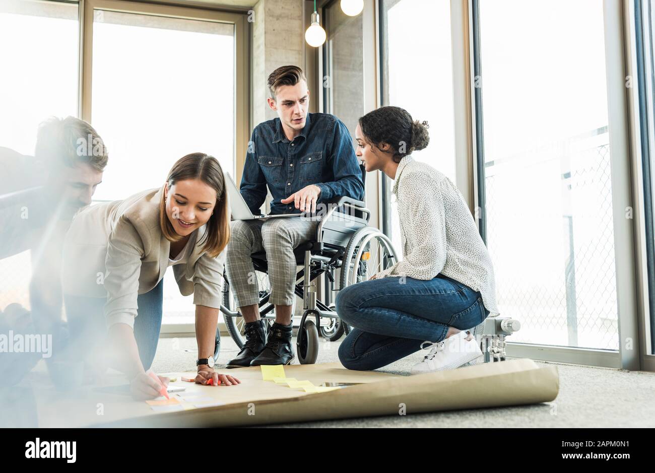 Young business people working together on a project in office Stock Photo