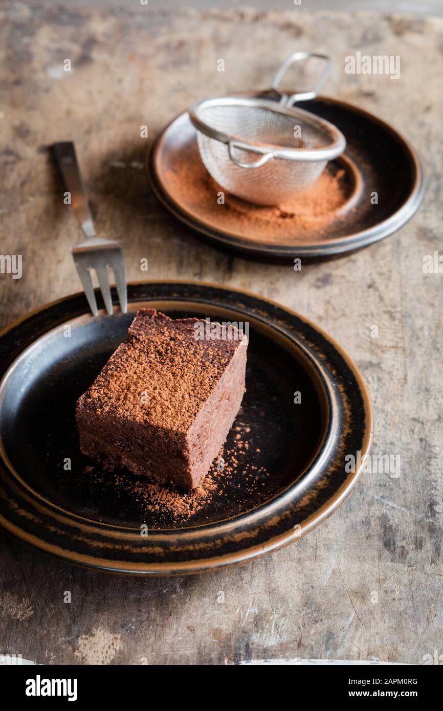 Plate with homemade gluten and sugar free brownie made with teff flour Stock Photo