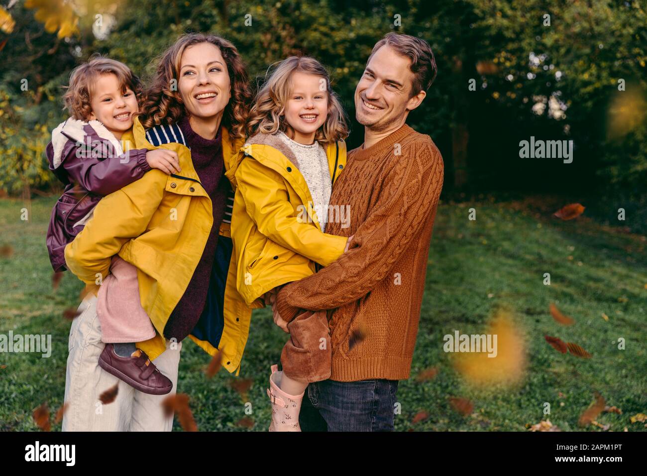 Portrait of happy family with two daughters outdoors in autumn Stock Photo