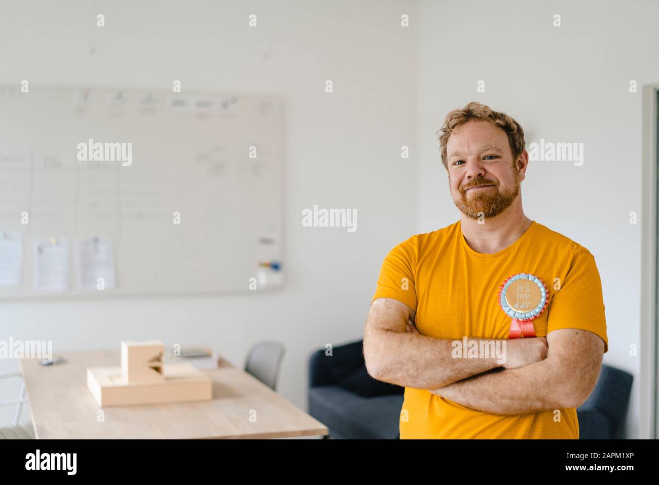 Portrait of a confident casual businessman with an award in office Stock Photo