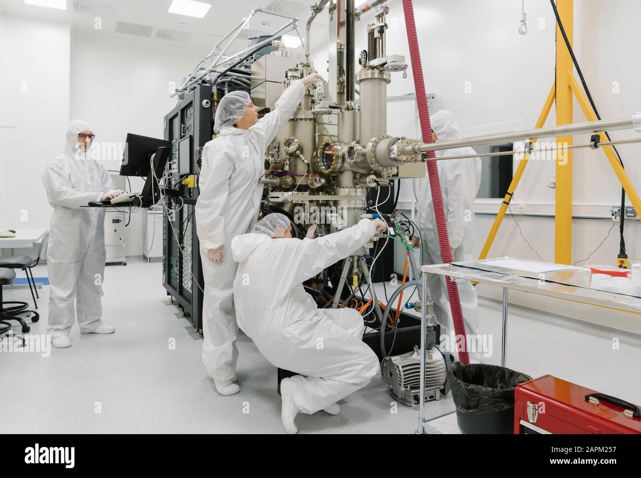 Laboratory technicians working on a device in laboratory of science center Stock Photo Alamy
