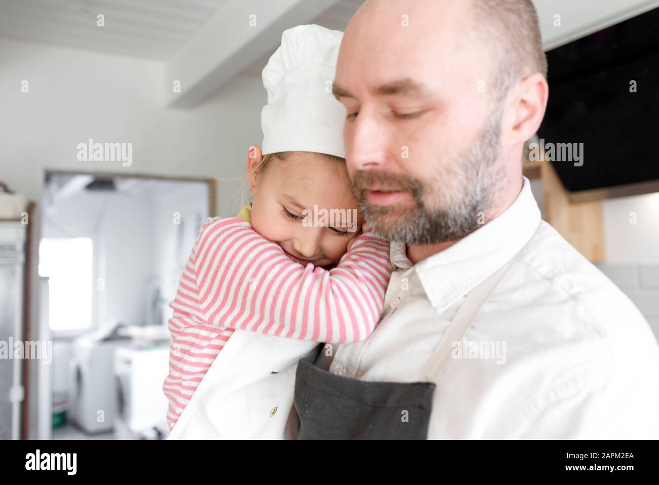 Father and daughter cooking in the kitchen Stock Photo