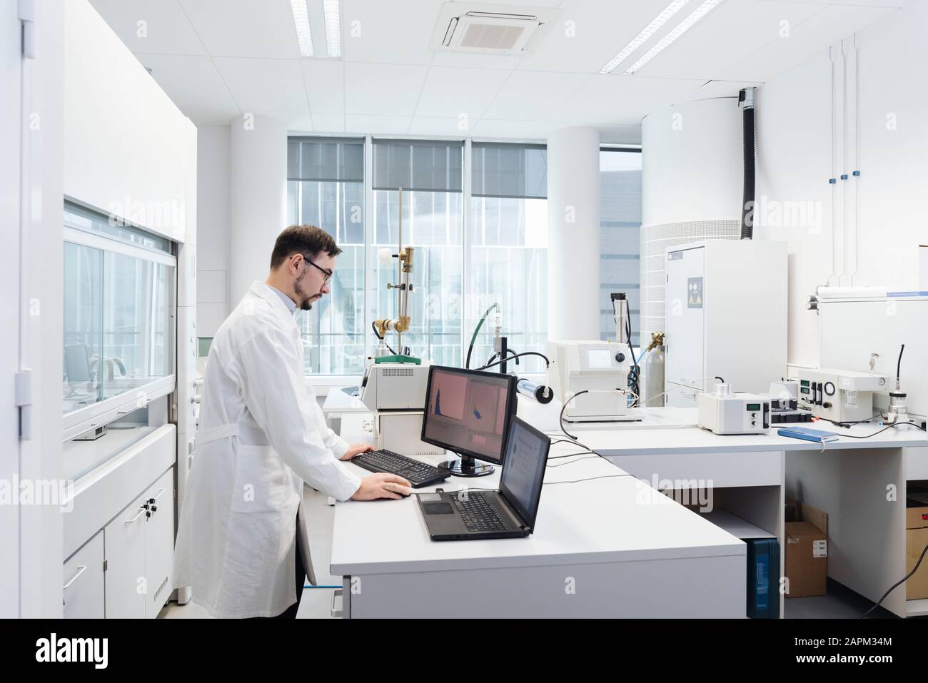 Scientist using computer in laboratory of technology center Stock Photo
