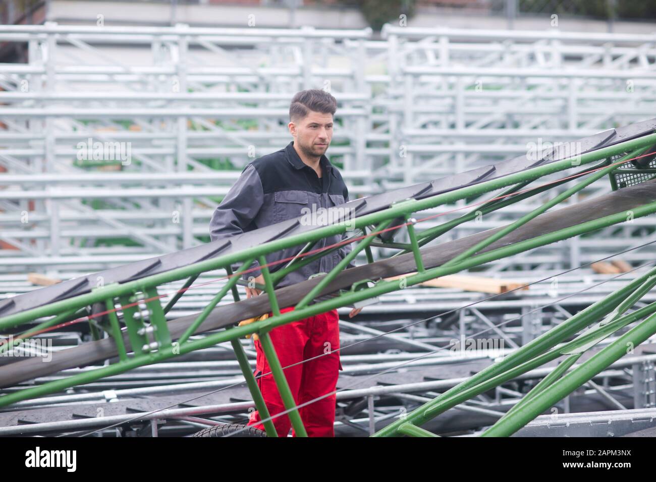 Skilled worker, working in conveyor belt shop Stock Photo