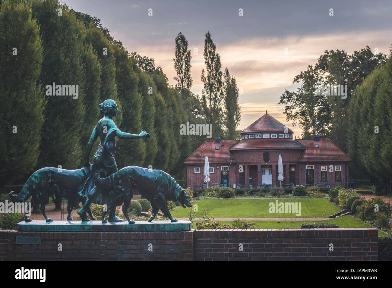 Germany, Hamburg, Diana with Dogs statue in front of drinking hall in Hamburg Stadtpark Stock Photo