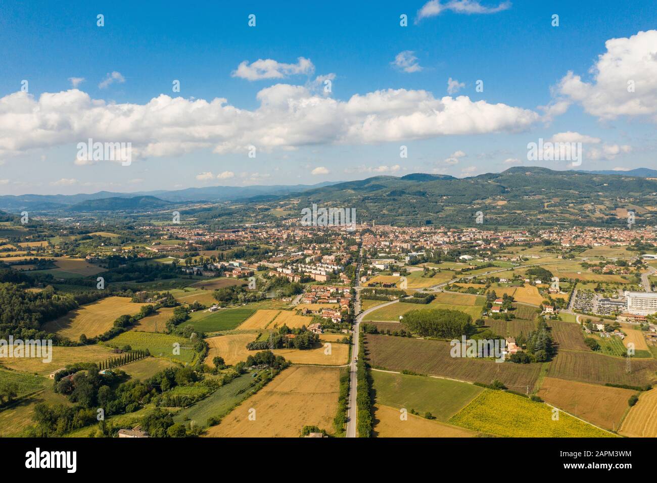 Italy, Province of Perugia, Citta di Castello, Aerial view of summer countryside with city in background Stock Photo