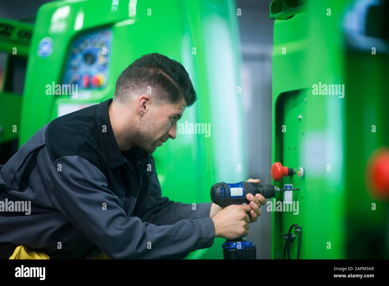 Skilled worker, working in conveyor belt shop Stock Photo