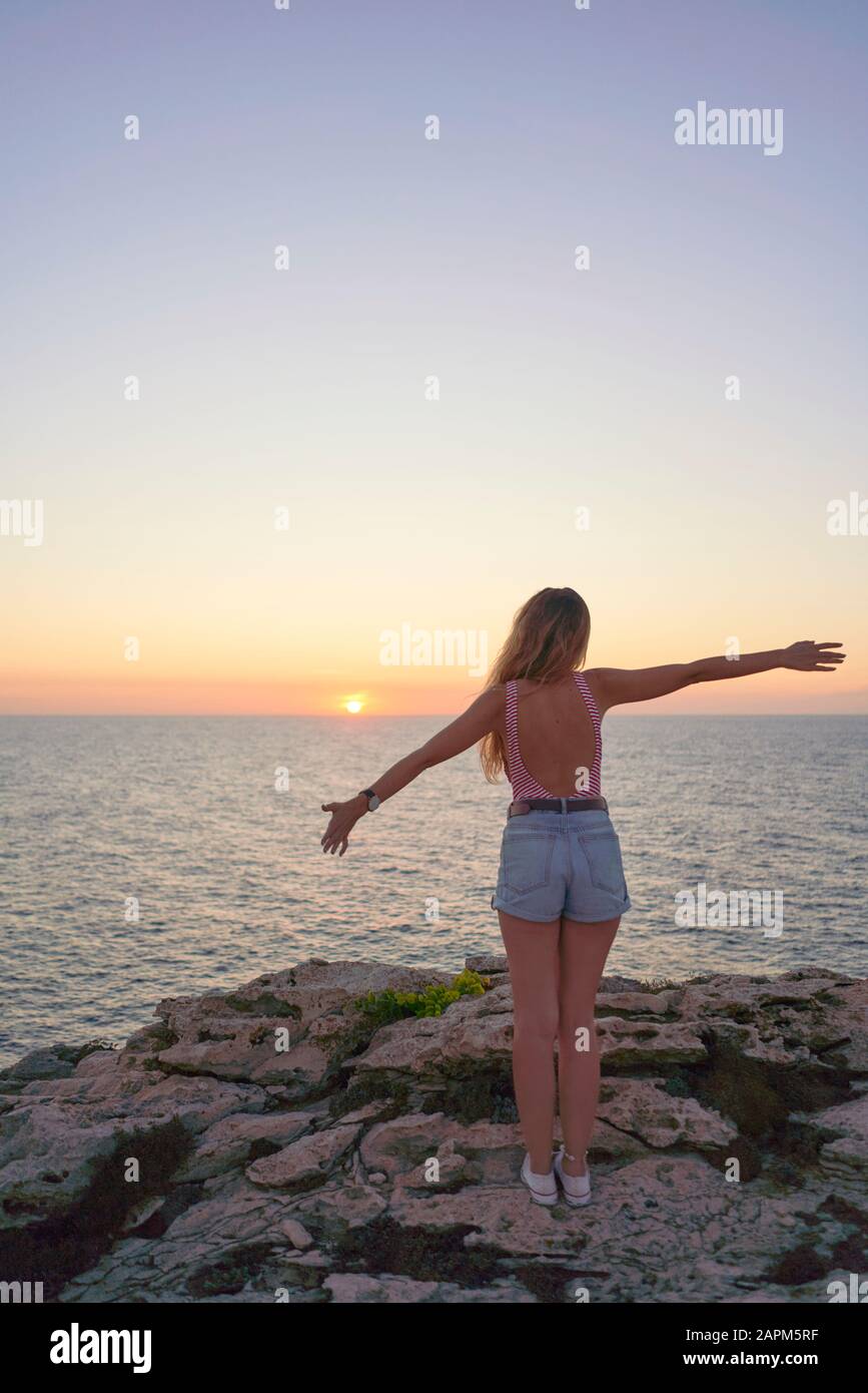 Rear view reaching up woman hi-res stock photography and images - Alamy