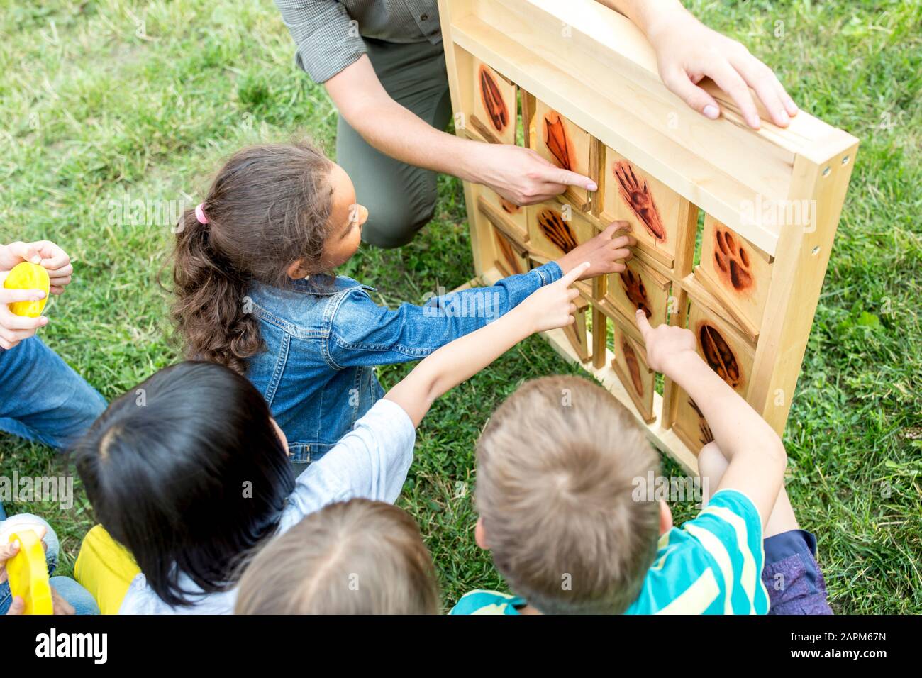 School children learning to recognize different animal feet Stock Photo
