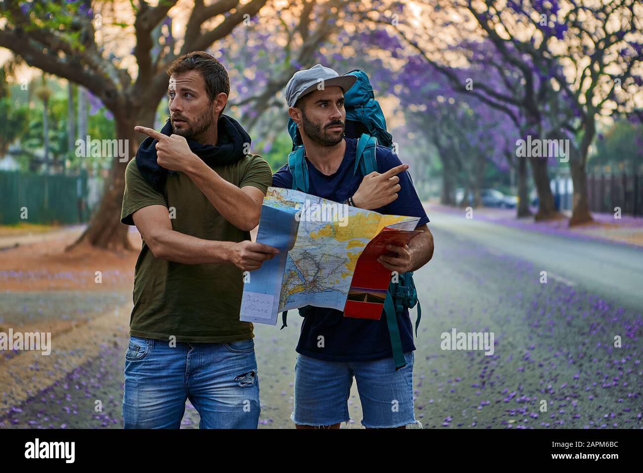 Backpackers with map on a street, Pretoria, South Africa Stock Photo - Alamy