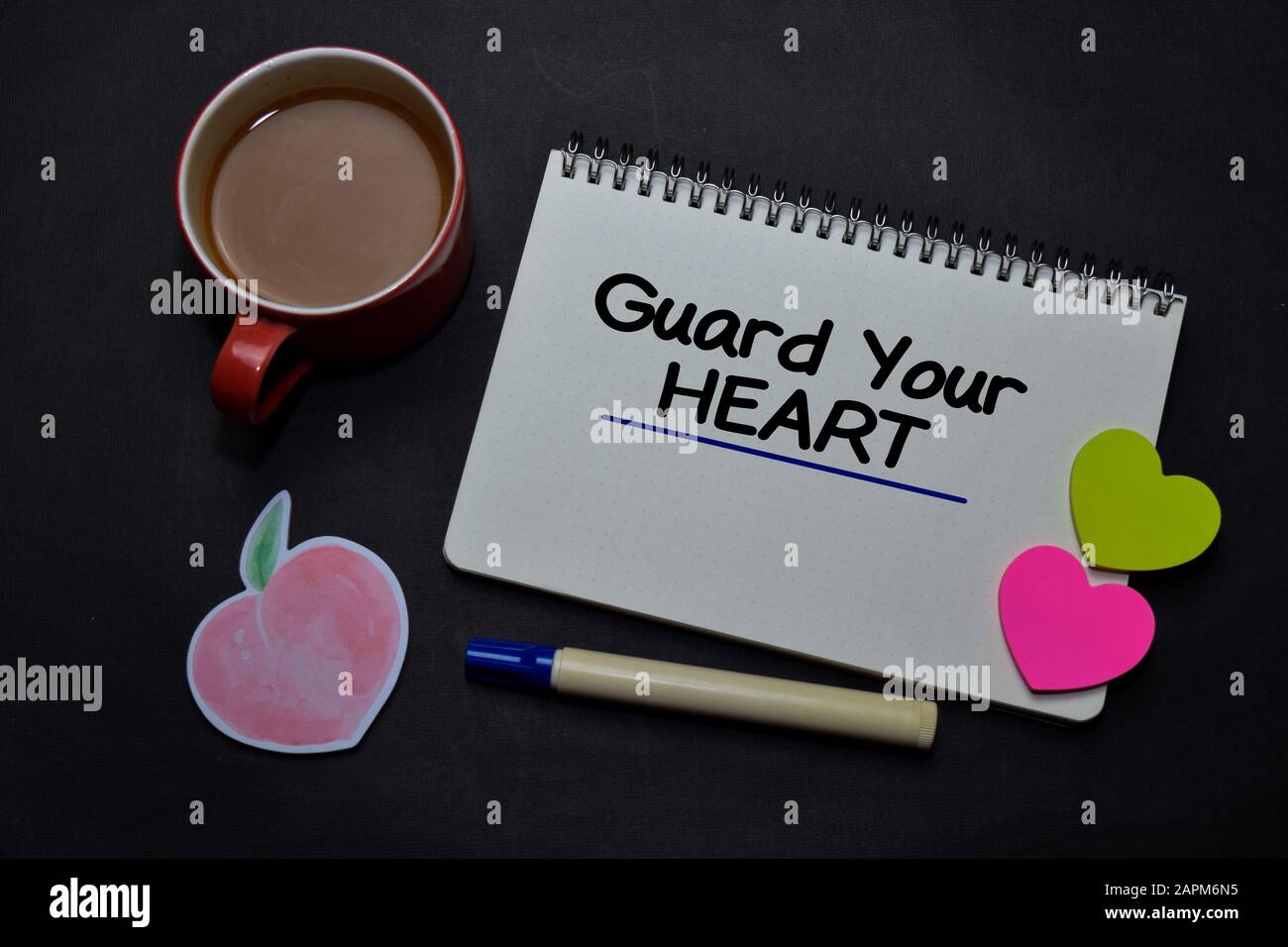 Guard Your Heart write on a book isolated on office desk. Christian