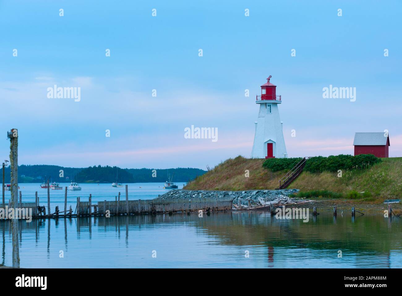 Mulholland Point Light on Campobello island guiding boats through Lubec Narrows between Canada and USA Stock Photo