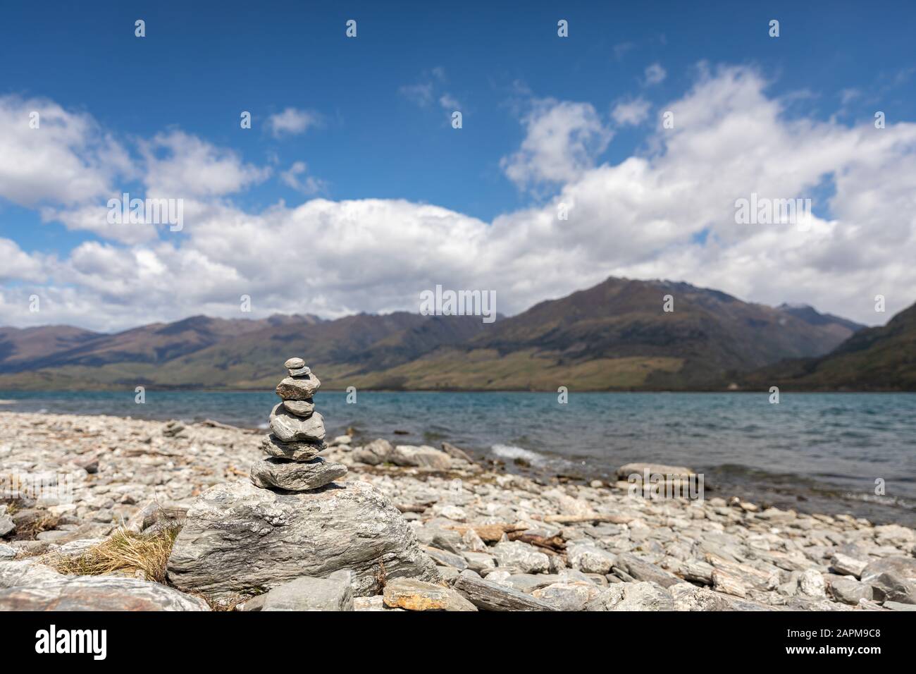 A stone cairn along the shores of Lake Wanaka in New Zealand Stock Photo
