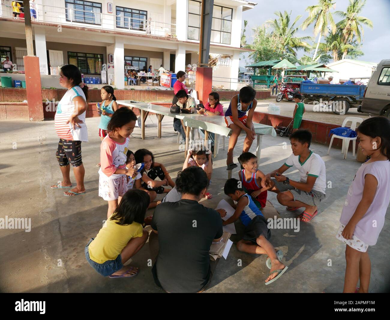 Dapilit Evacuation Center, Alitagtag, Batangas. Evacuated children from the lockdown town of San Nicholas, Batangas underwent a Trauma Informed Resiliency Workshop conducted by Salinlahi Children's Rehabilitation Center, through an Art Workshop, aims to help children from the heavily affected areas from the context of the recent volcanic eruption, cope and recover from the event and be resilient enough to overcome adversity and continue the children's normal development. Workshop had a small group engaging communal conversation, discussing information about volcanos, how it affects the people, Stock Photo