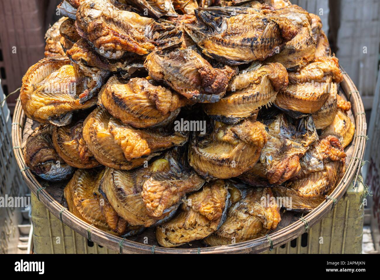 Dried fish rolled up ans stacked in Ang Thong Thailand local market Stock Photo