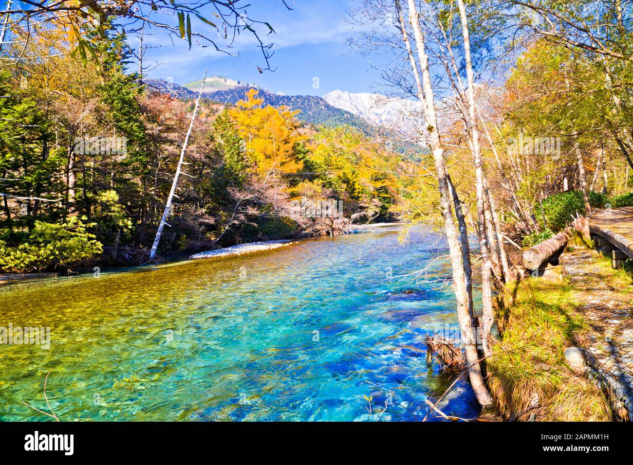 Azusa River flowing through Kamikochi national park in Nagano Prefecture, Japan. The autumn leaves season is beautiful. Stock Photo