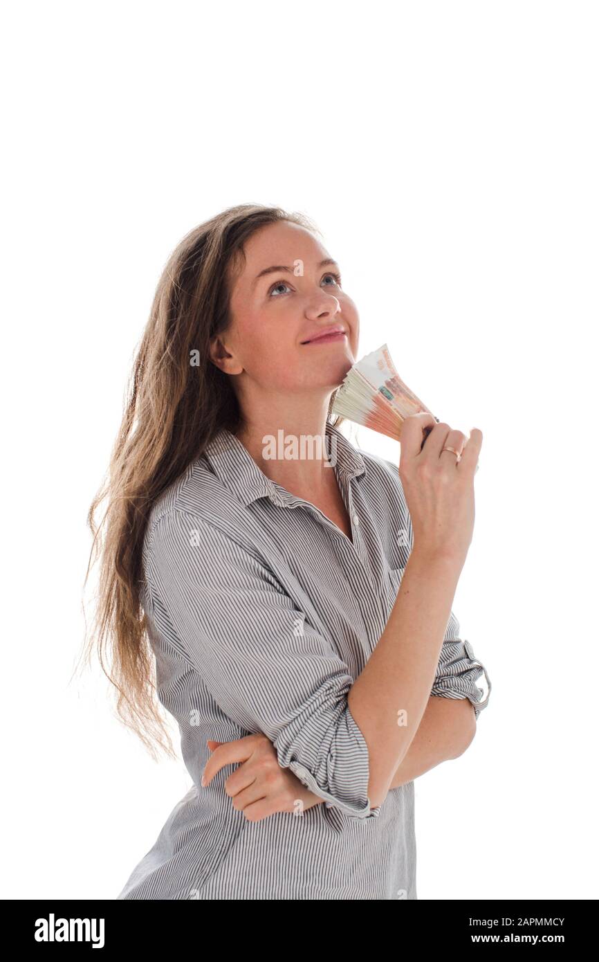 Content woman dreaming of spending money Stock Photo