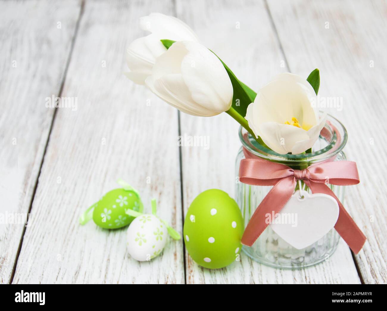 Easter eggs and tulips on a old wooden background Stock Photo - Alamy